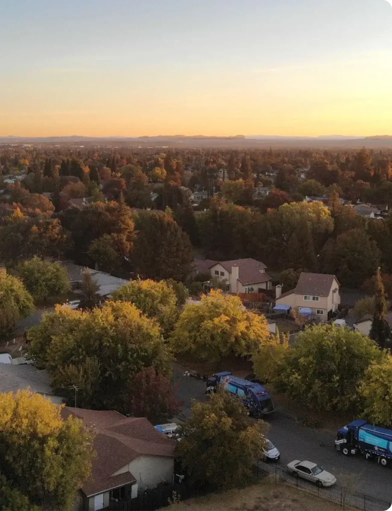 Aerial view of an Auburn CA residential neighborhood at sunset